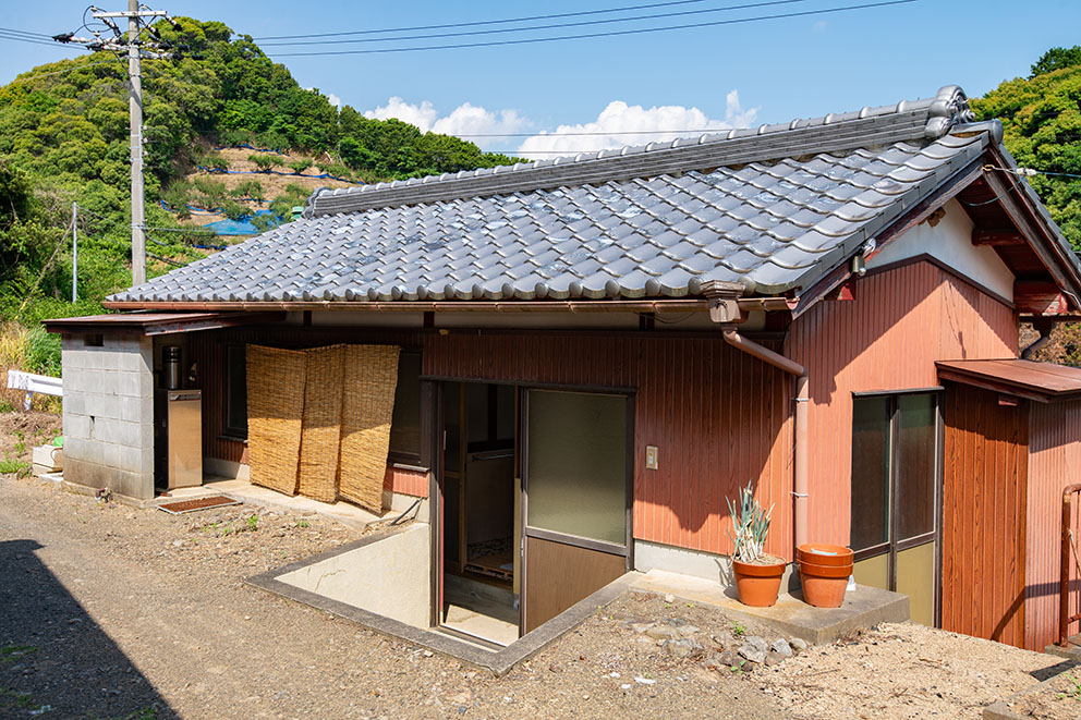 Toilet and bath facilities beside house