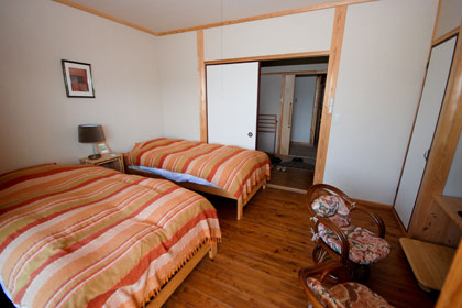 Western style guestroom with wooden flooring
