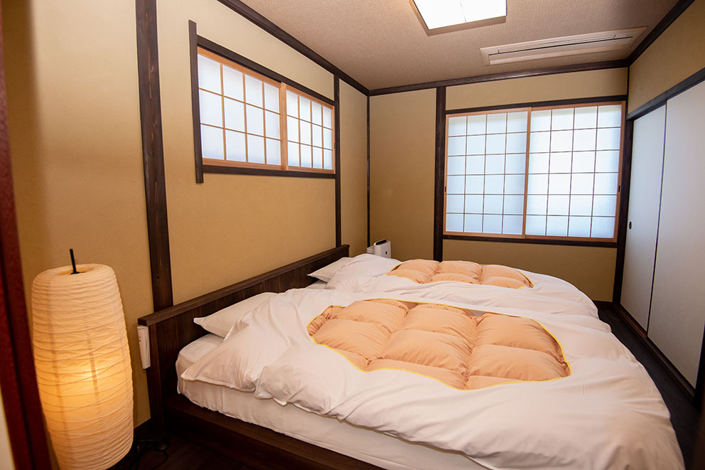 Sleeping area in main building guestroom