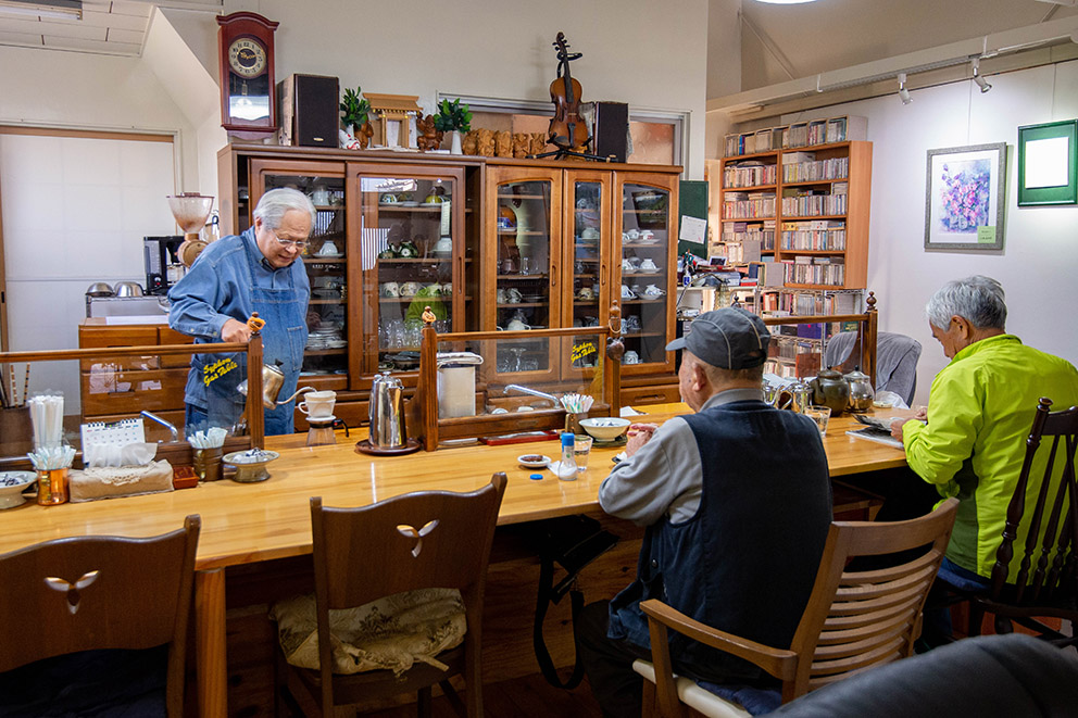 Cafe owner and regular customers